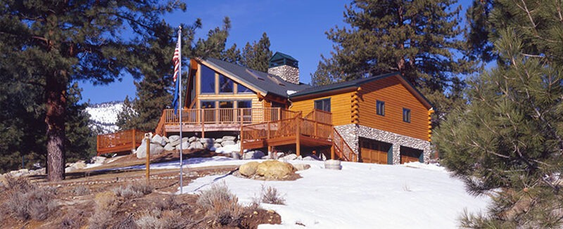 Carson City Log Home exterior in snow