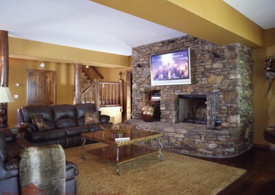 Shell Knob Log Home 10799 den with fireplace