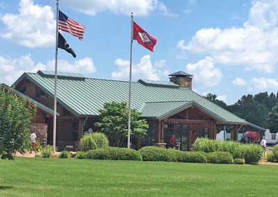 Arkansas Welcome Center with flags waving