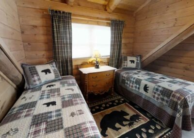 Creekside Comfort Cabin interior view of bedroom.