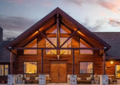 View of exterior of Rush Creek Ranch addition at dusk.